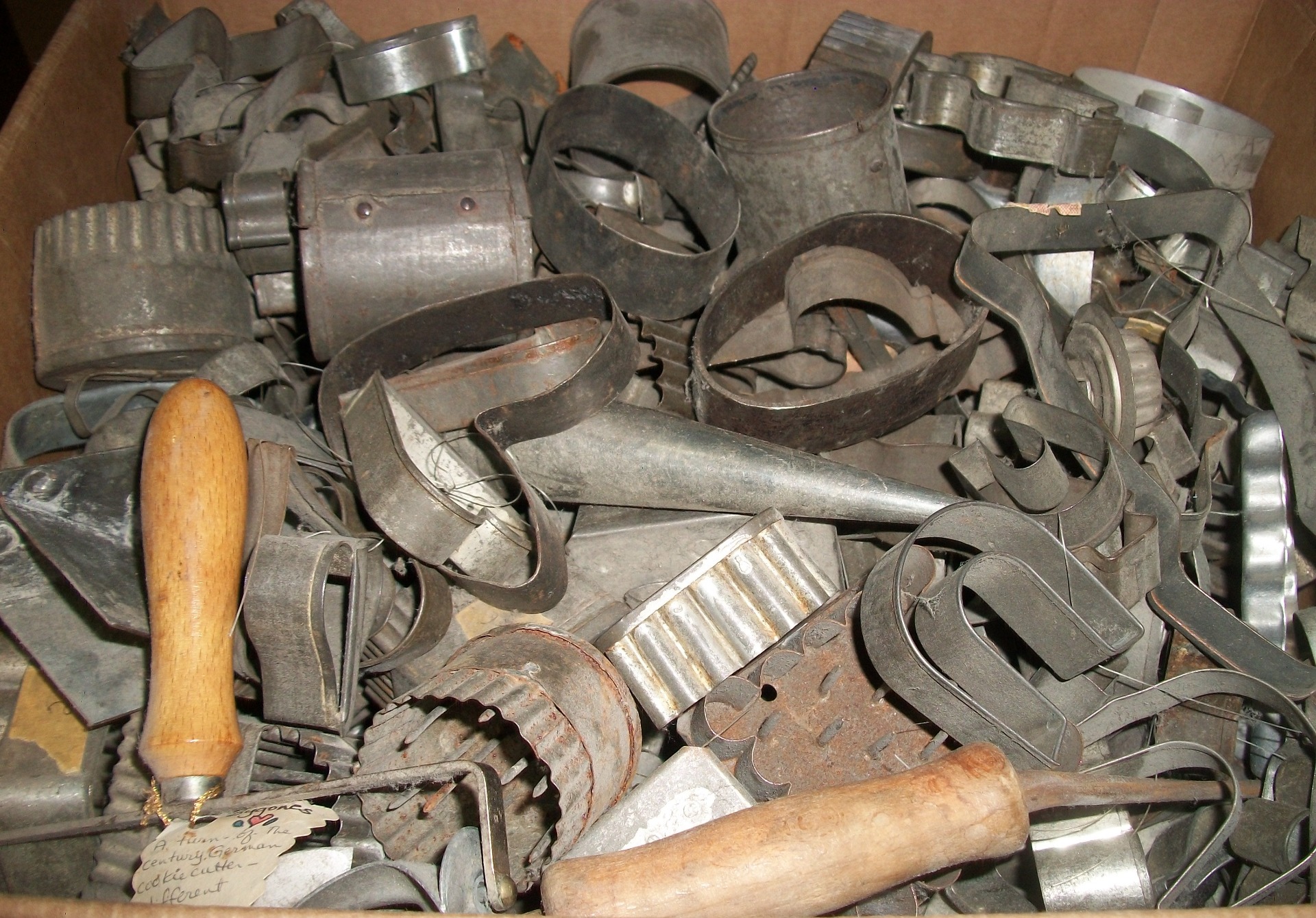 Dozens of circa WWII & older tin cutters ... most from Germany.