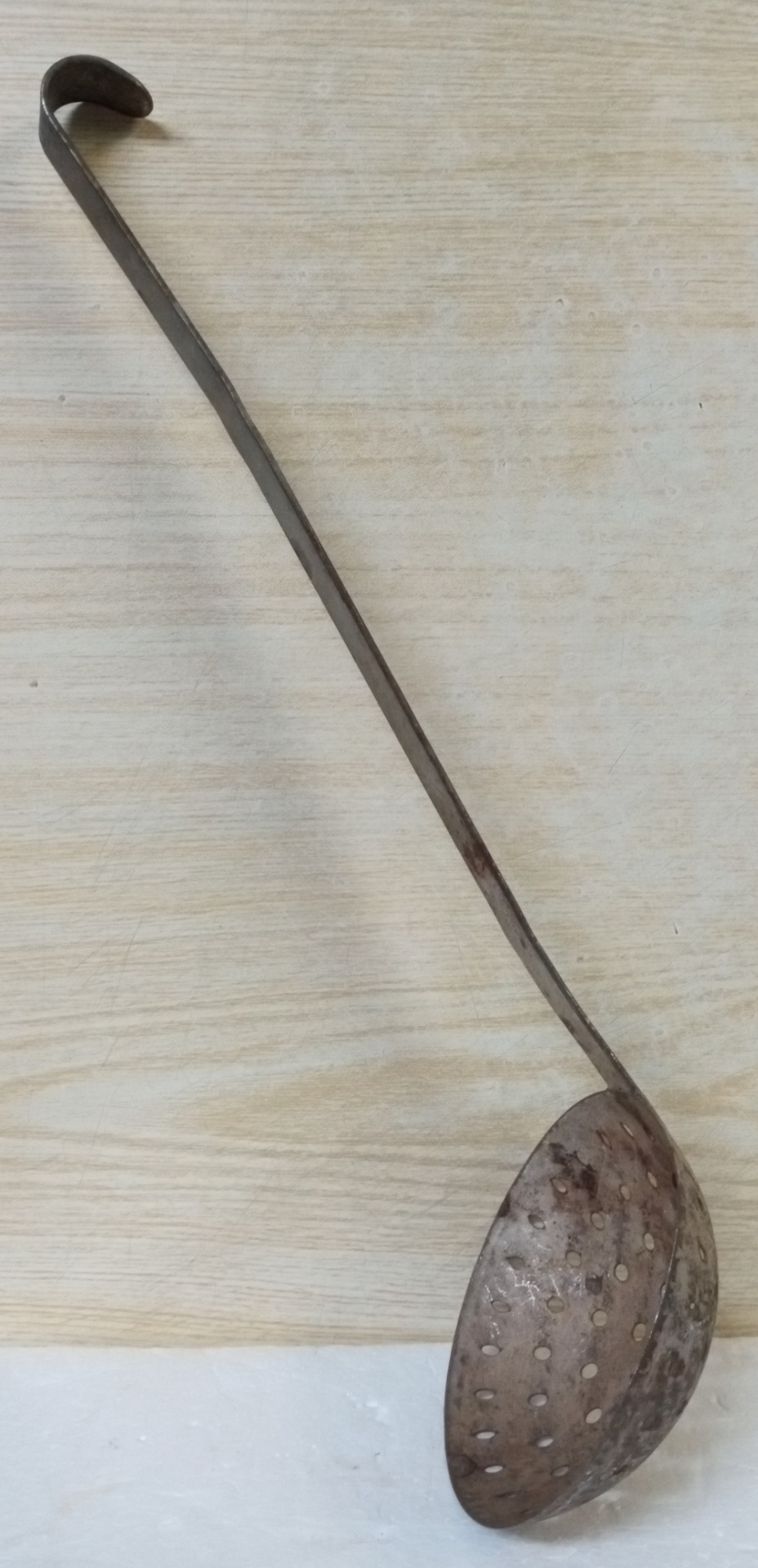 a strainer ladle (in the books)