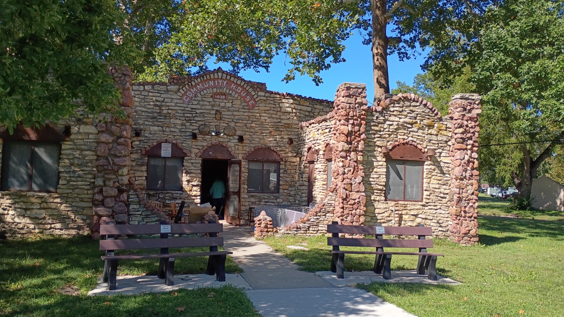 A very unusual stone building in the city park. It was open with a sale inside.