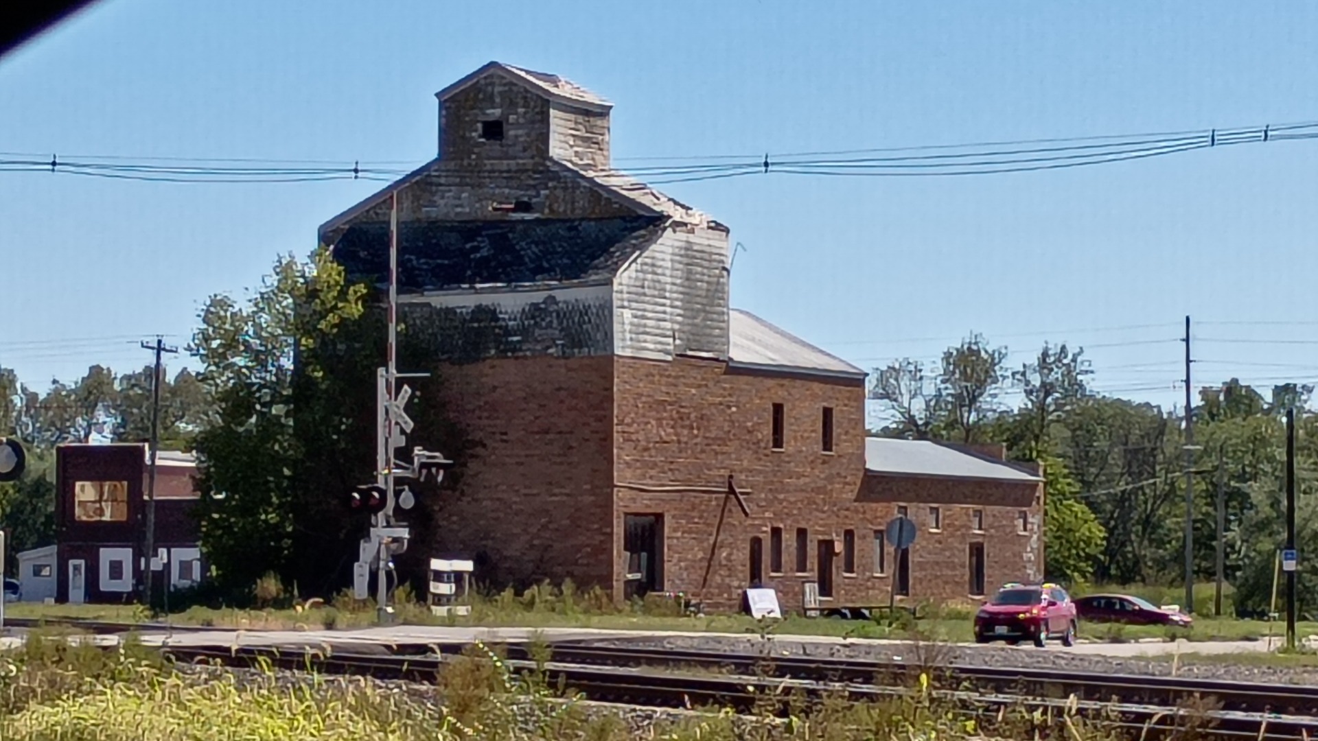 A unique and historic building by the railroad tracks.